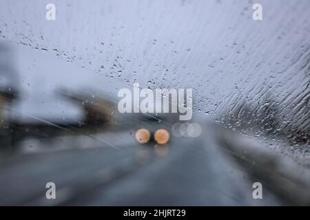 Driving during rainy day on a road in Poland, view on a drops on a windshield Stock Photo