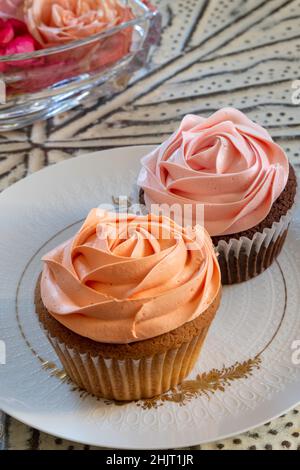 Elegant Rose cupcakes on a designer china plate, USA Stock Photo