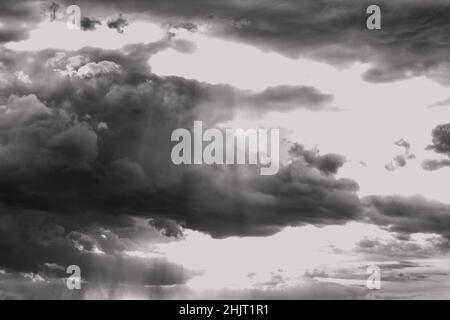 huge clouds in the sky before the storm, dramatic clouds in black and white Stock Photo