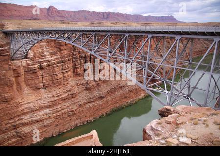 Glen Canyon Arch Dam Bridge over the Colorado river waters in Arizona Stock Photo