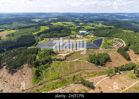 Aerial photograph, forest area with forest damage and clear-cutting, area covered with plastic tarpaulins of the heaped up waste disposal site Olper E Stock Photo