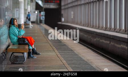 Moscow, Russia - October 25, 2020: Girl waiting for a train at Vorobyovy Gory metro station Stock Photo