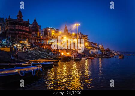 Funeral pyres burning at night on Manikarnika Ghat at Varanasi (formerly Banaras or Benares), a city on the River Ganges in Uttar Pradesh, north India Stock Photo