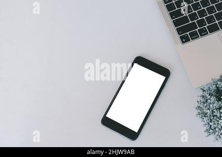Mockup a mobile phone and computer laptop. Blank screen with text or image for an advertisement. Stock Photo