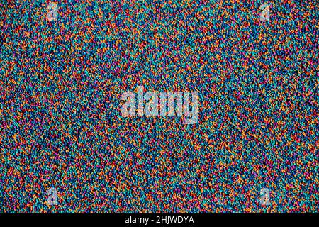 Colorful abstract rainbow colors of a soft rubber play surface. Stock Photo
