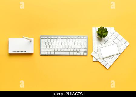Different gadgets on color background Stock Photo