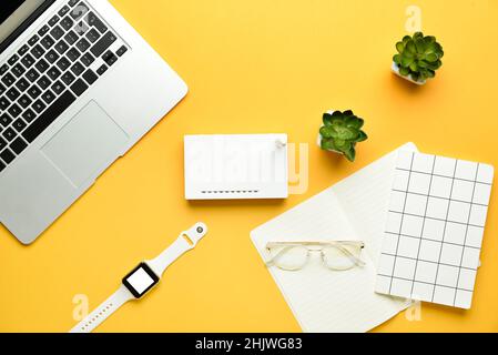 Different gadgets on color background Stock Photo