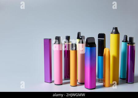 Vape e-cigarettes on a gray background with a place for text or product  advertising. Copy space Stock Photo