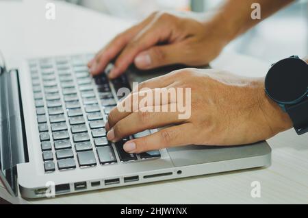 Male hands using computer for information or social media and communication business Stock Photo