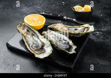 Seafood Brassiere, open Oysters with lemon. Isolated, white