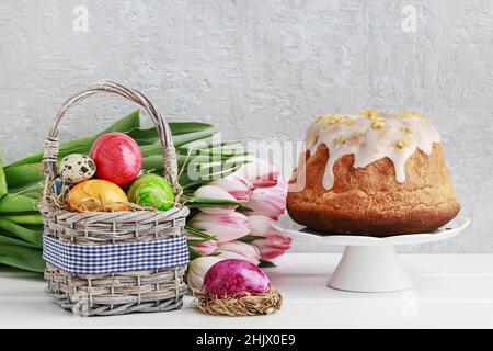 Basket with Easter eggs and traditional cake. Festive time Stock Photo