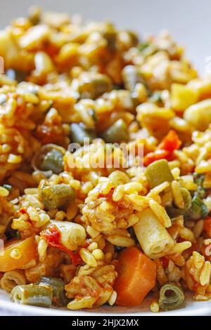 Chicken curry with basmati rice and green peas, dish popular in India. Stock Photo