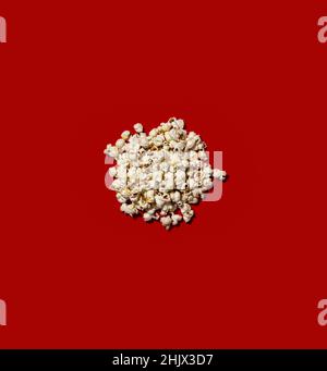 Popcorn heap on red background. Stock Photo