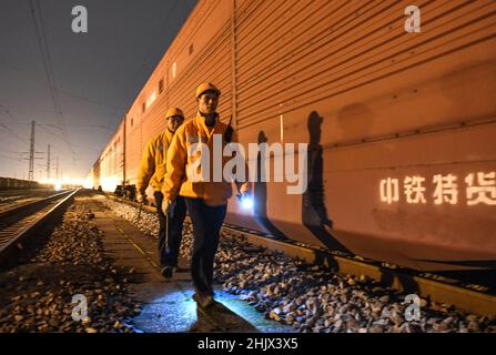 Liuzhou, China's Guagnxi Zhuang Autonomous Region. 31st Jan, 2022. Staff members return from work at a railway station in Liuzhou, south China's Guagnxi Zhuang Autonomous Region, Jan. 31, 2022. On the eve of the Chinese Lunar New Year, staff members at the railway station stuck to their posts to ensure the safe operation of the trains. Credit: Zhang Ailin/Xinhua/Alamy Live News Stock Photo