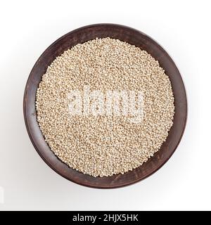 Dried white quinoa seeds in ceramic bowl isolated on white background with clipping path Stock Photo