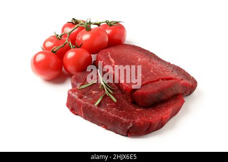 Raw beef steaks with tomatoes isolated on white background Stock Photo