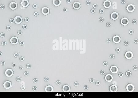 Frame made with metal hexagon nuts on gray background. Abstract border. Top view Flat lay Copy space. Stock Photo