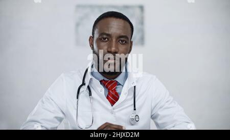 serious african american doctor with stethoscope looking at camera Stock Photo