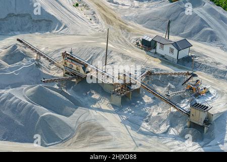 VALLDAL, NORWAY - 2020 JUNE 03. Heavy machinery at the quarry. Stock Photo