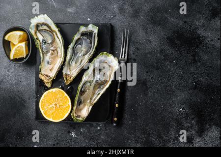 Seafood Brassiere, open Oysters with lemon. Isolated, white