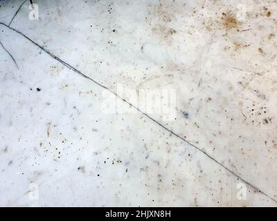 Old cracked marble stone wall background with a white weathered distressed texture which would be useful for graphics blending, stock photo image Stock Photo