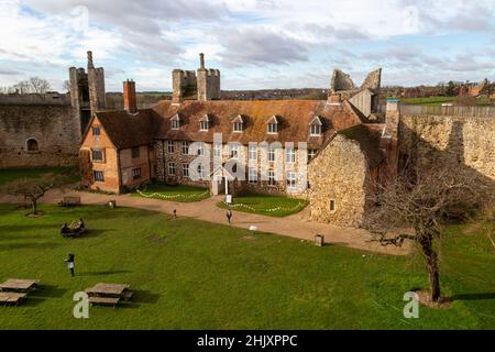 View from wall over interior of castle, Framlingham, Suffolk, England, UK - Framlingham College in background Stock Photo