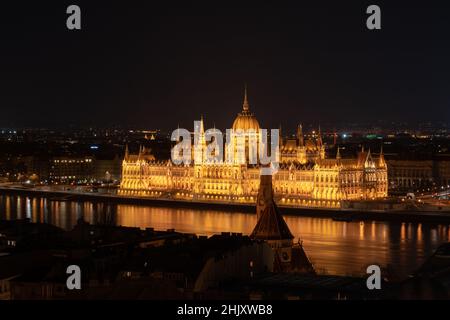 Hungarian parliament building from across the Danube river at night Budapest Hungary Europe Stock Photo