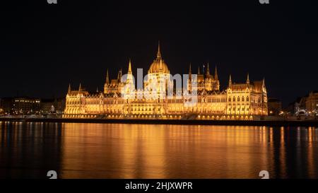 Hungarian parliament building from across the Danube river at night Budapest Hungary Europe Stock Photo