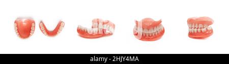 Full denture close-up. Dentures. Full removable plastic denture of the jaws. Isolate on white background acrylic prosthesis of human jaws. The concept Stock Photo