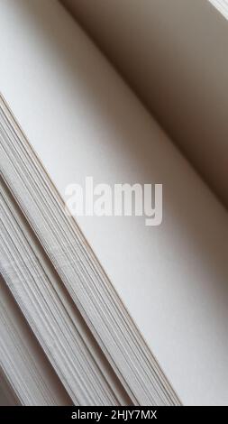 Closeup white blank sheets of thick notepad paper Stock Photo