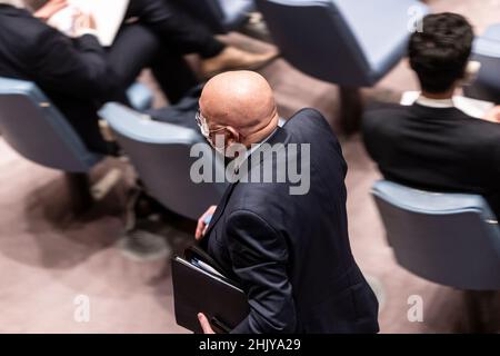 New York, New York, USA. 31st Jan, 2022. New York, NY - January 31, 2022: Vassily Nebenzia, Permanent Representative of the Russian Federation leaves SC meeting on situation on Ukrainian-Russian borders at UN Headquarters just a minute before Ukrainian Ambassador is about to start his speech. US called a meeting to discuss Moscow's troop build-up on its borders with Ukraine and additional build up by moving some troops to Belarus. The US and UK have promised further sanctions if Russia invades Ukraine. Russia had tried to block the open session of the SC but was outvoted by 10 vote Stock Photo
