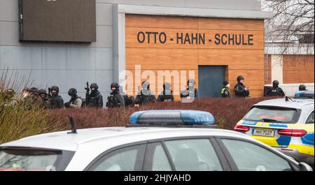 Hamburg, Germany. 01st Feb, 2022. Heavily armed police forces stand in front of the Otto Hahn School in the Jenfeld district. A youth armed with a firearm is believed to have gained access to the school. Credit: Daniel Bockwoldt/dpa/Alamy Live News Stock Photo