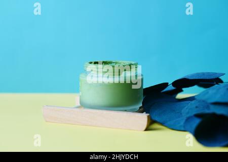 bubble clay mask in container on color background  Stock Photo