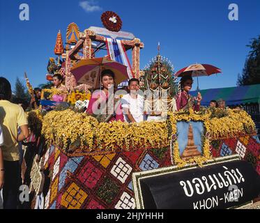 Thailand. Bangkok. Flower festival. Thai men and women on carnival float. Stock Photo