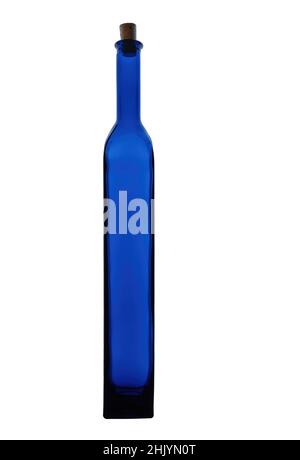 Tall, thin, bright blue glass bottle isolated on white background. Stock Photo