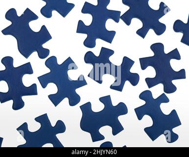 Blue jigsaw puzzle pieces isolated on white background. Stock Photo