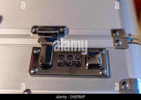 Combination lock on aluminum briefcase from the top Stock Photo