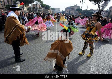 Rome, Italy 14/02/2010: First Edition of the Latin American Carnival in Rome. Via dei Fori Imperiali, Colosseum. © Andrea Sabbadini Stock Photo