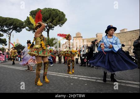 Rome, Italy 14/02/2010: First Edition of the Latin American Carnival in Rome. Via dei Fori Imperiali, Colosseum. © Andrea Sabbadini Stock Photo