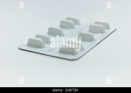 Medications pills in the blister pack on white background Stock Photo