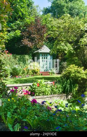 House Back garden with bespoke summerhouse and beautiful flower displays, design, Polmont, Falkirk, Central Scotland, UK Stock Photo