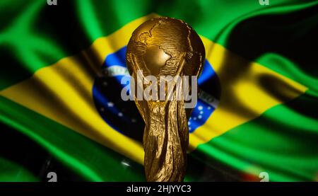 October 6, 2021 Brasilia, Brazil. FIFA World Cup on the background of the flag of Brazil. Stock Photo