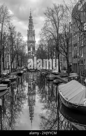 Black and white Hillsong Church with several parked bicycles and boats on an Amsterdam canal Holland Stock Photo