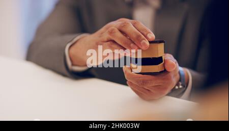 I should've done this ages ago. 4k video footage of a man proposing in a restaurant. Stock Photo