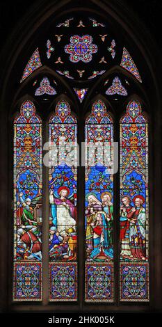 A stained glass window depicting Three Maries and Apostles at the Empty Tomb, Christ Church, Swindon, Wiltshire Stock Photo