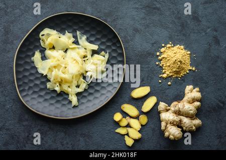 Pickled ginger slices, fresh root, pile ginger powder Stock Photo