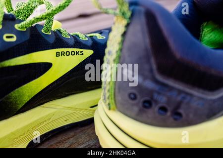 Brooks running shoes and CEP compression socks, legs female runner run  marathon in city, summer sports race Stock Photo - Alamy