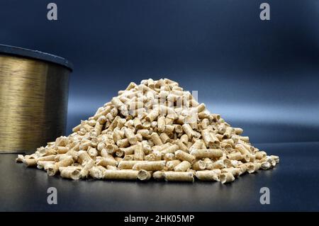 Wood pellets. Perfect heating system, to be placed in a home fireplace or stove. Stock Photo