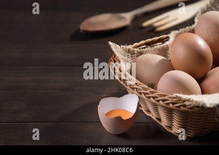 Chicken eggs on dark background with copyspace. Farm products, natural eggs. Stock Photo