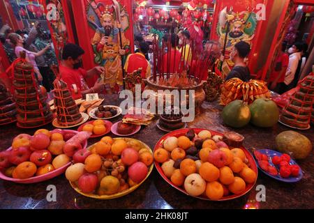 A number of congregants pray the eve of Chinese New Year at the Hok Lay Kiong Temple, which was founded in the 18th century and is the first and largest pagoda in the city of Bekasi, West Java, Indonesia, on January 31, 2022. Because it is still in the atmosphere of the Covid-19 pandemic and in the midst of increasing Covid-19 cases, the Omricon variant, by the temple management, tonight's worship is held in a limited manner and the number of people allowed to pray is a maximum of 50 people in turn. (Photo by Kuncoro Widyo Rumpoko/Pacific Press/Sipa USA) Stock Photo